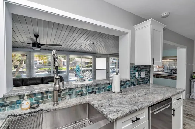 a kitchen with granite countertop lots of counter top space