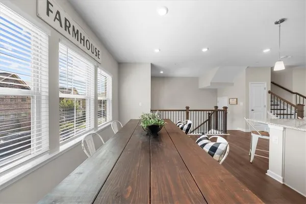 a balcony with furniture and wooden floor