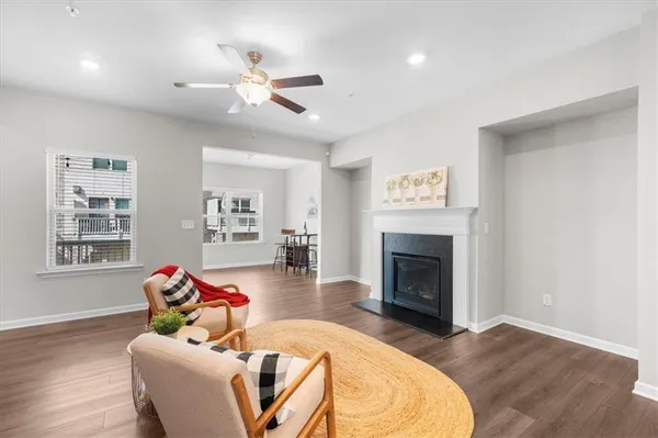 a living room with furniture fireplace and window