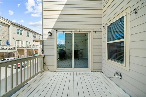a view of a balcony with wooden floor