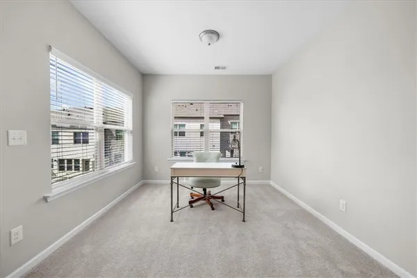 a work room with furniture and a window
