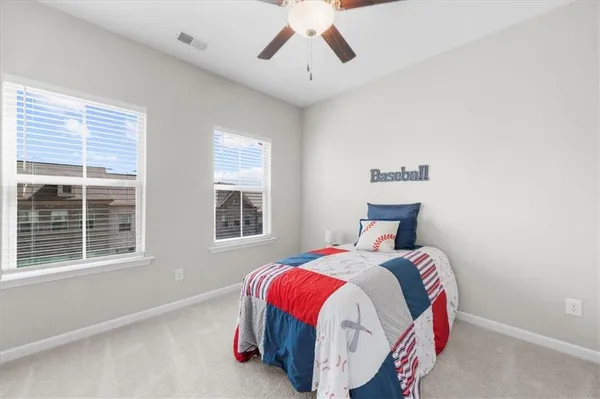 a bed room with a bed and a large window