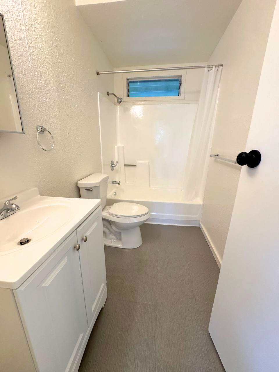 18-4069 Mauna Kea Drive Mountain View, HI 96771 - Photo 9 of 12 a bathroom with a double vanity sink a toilet a shower and a mirror