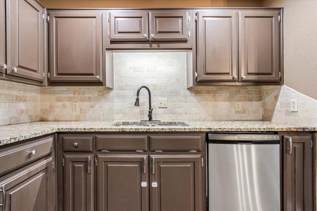 9508 Riviera Drive Waco, TX 76712 - Photo 12 of 24 a view of a kitchen with granite countertop cabinets and a sink