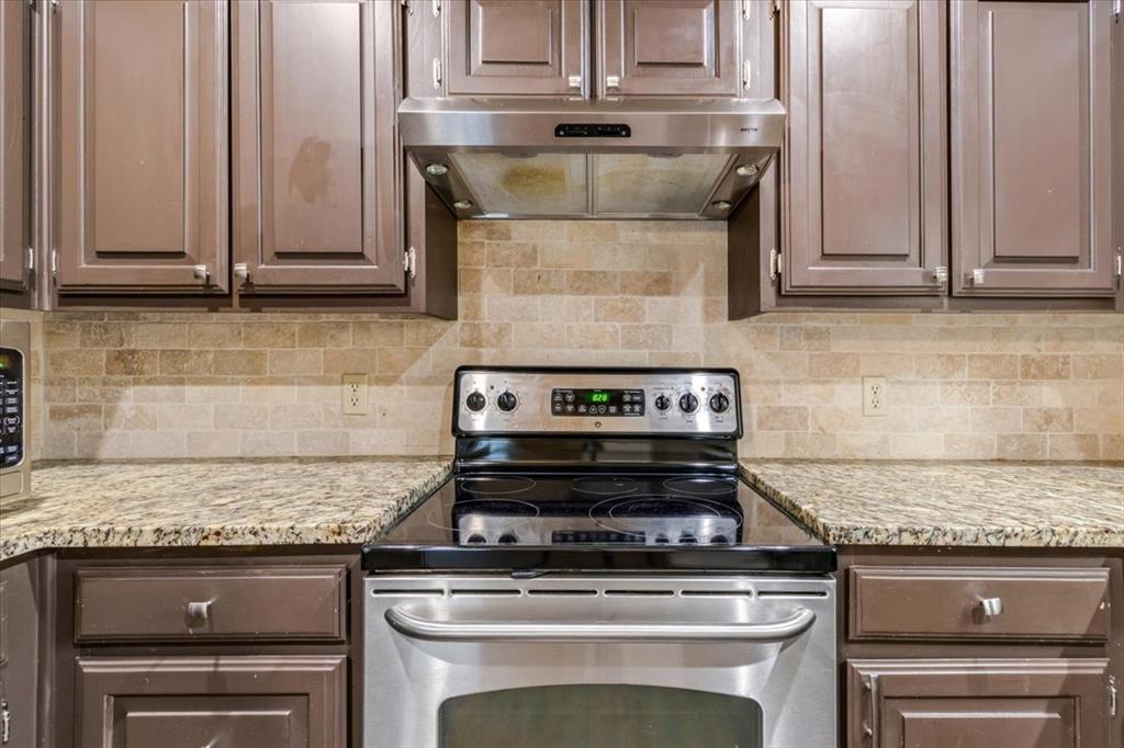 9508 Riviera Drive Waco, TX 76712 - Photo 13 of 24 a stove top oven sitting inside of a kitchen