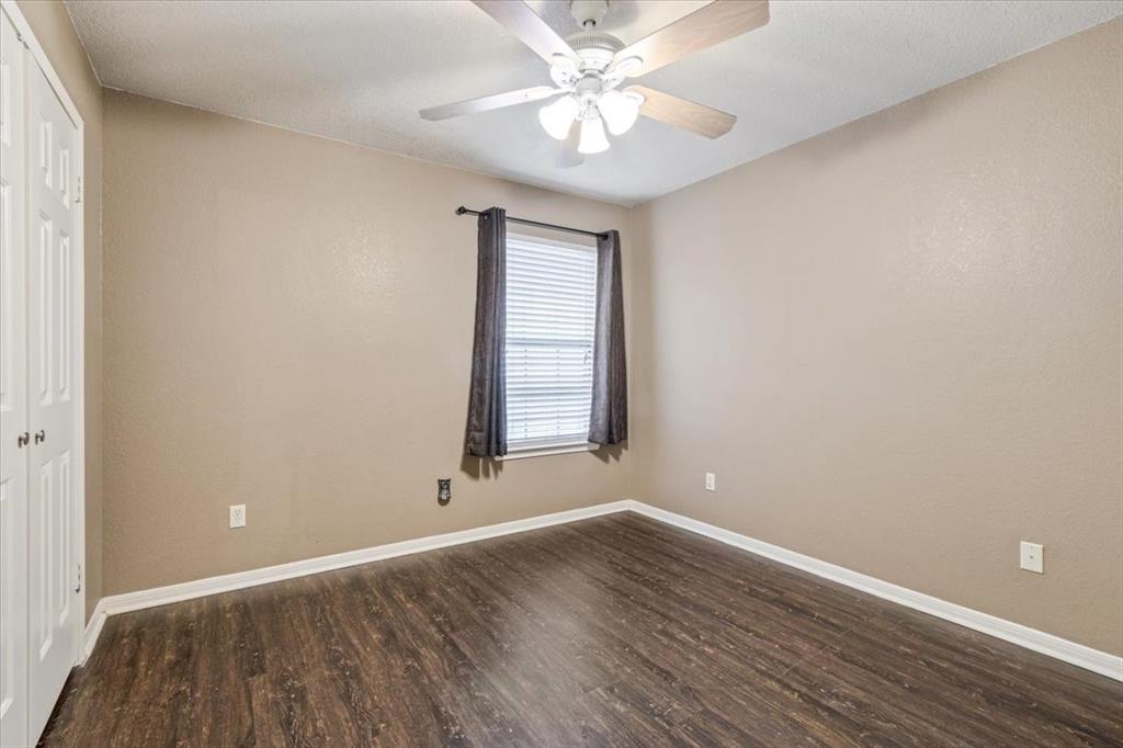 9508 Riviera Drive Waco, TX 76712 - Photo 19 of 24 a view of wooden floor and windows in a room