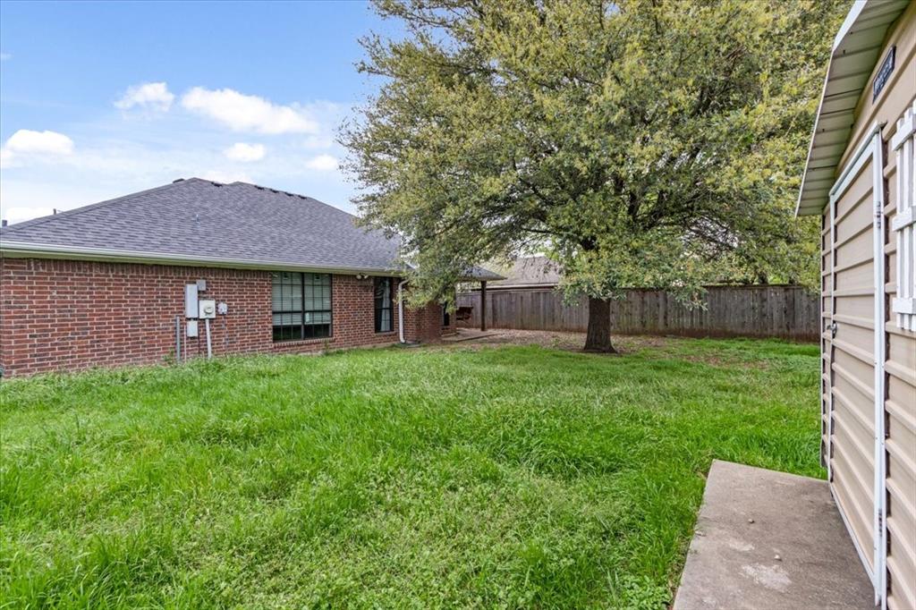 9508 Riviera Drive Waco, TX 76712 - Photo 20 of 24 a view of a house with a yard
