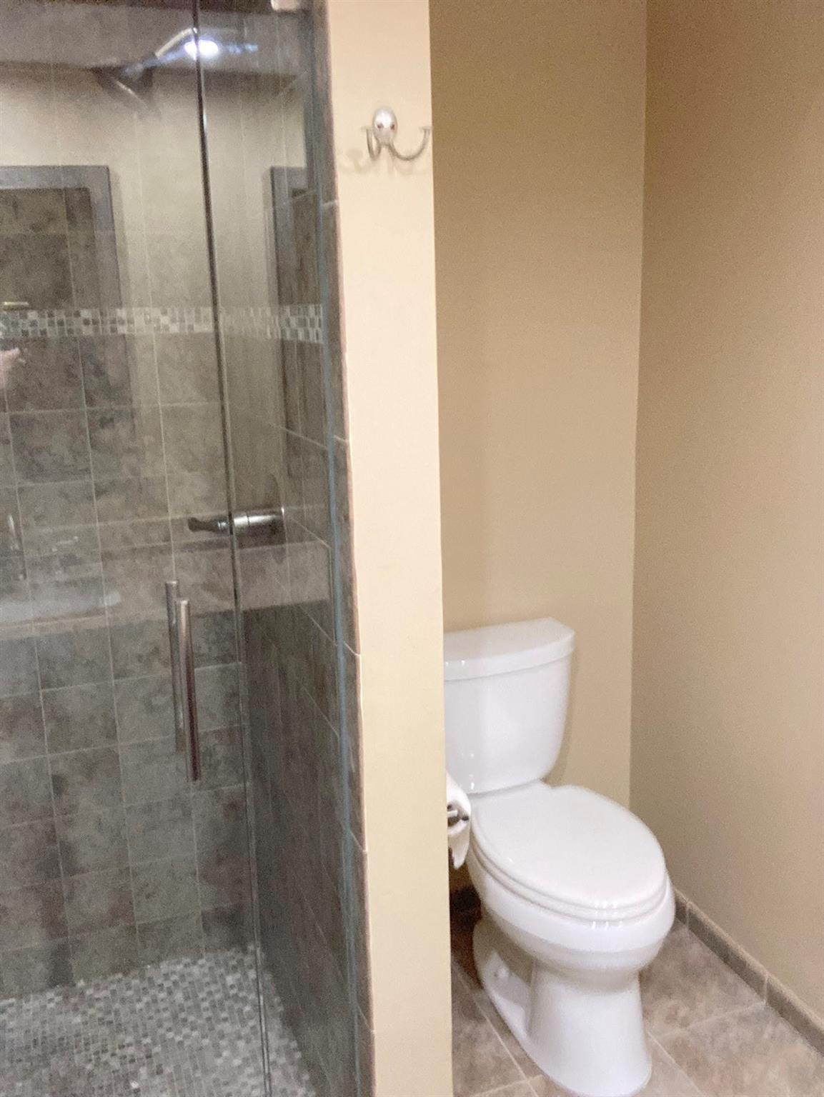 7586 Courtyard Run East Boca Raton, FL 33433 - Photo 15 of 26 Nice tiled shower with glass doors