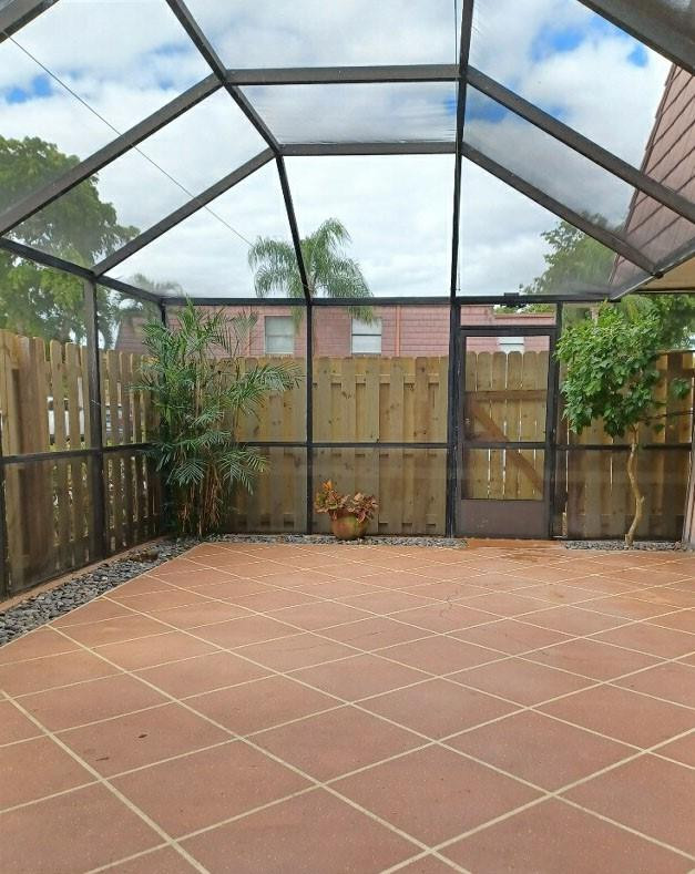 7586 Courtyard Run East Boca Raton, FL 33433 - Photo 24 of 26 Courtyard w/new fencing installed