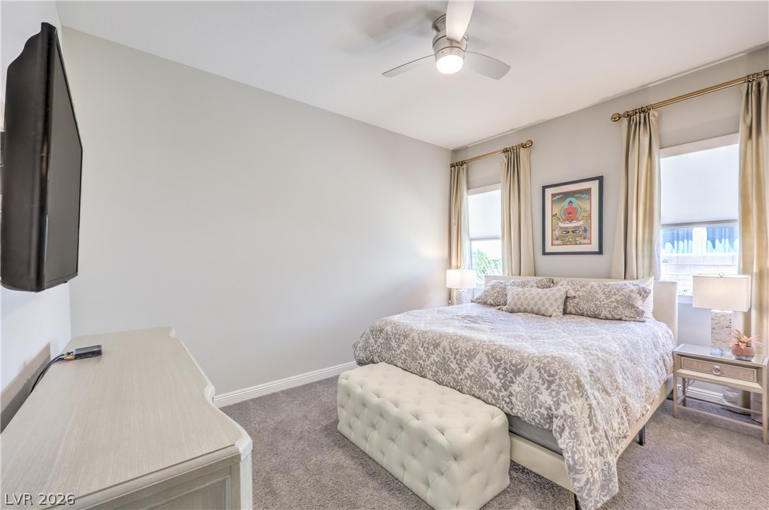 7119 Arabian Ridge Street Las Vegas, NV 89131 - Photo 34 of 73 Plush carpeting creates a serene retreat in this well-appointed bedroom.