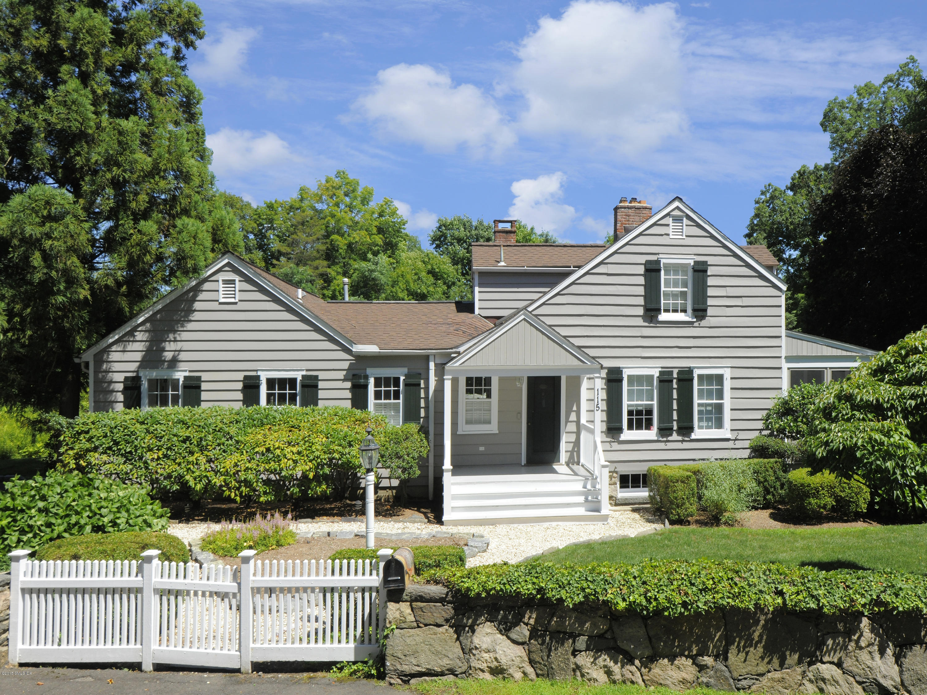 a house with trees in the background