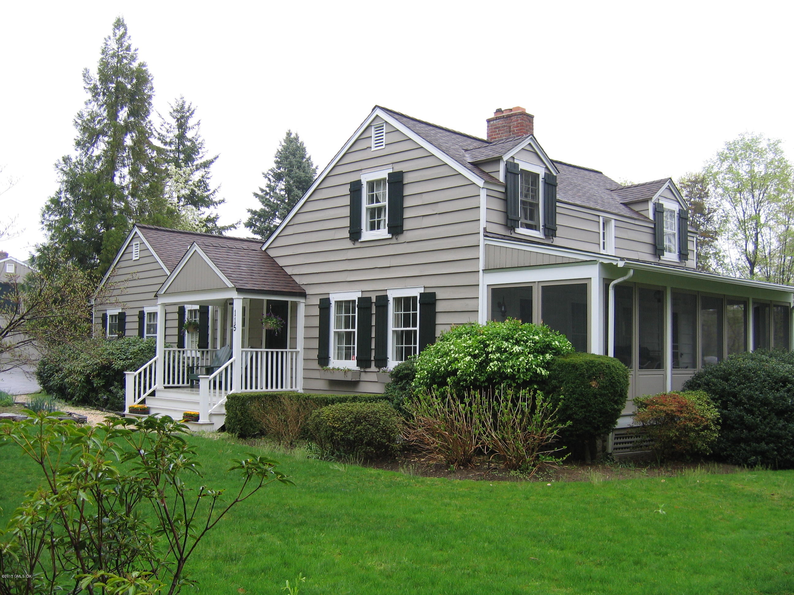 115 Doubling Road Greenwich, CT 06830 - Photo 2 of 10 a front view of a house with a garden
