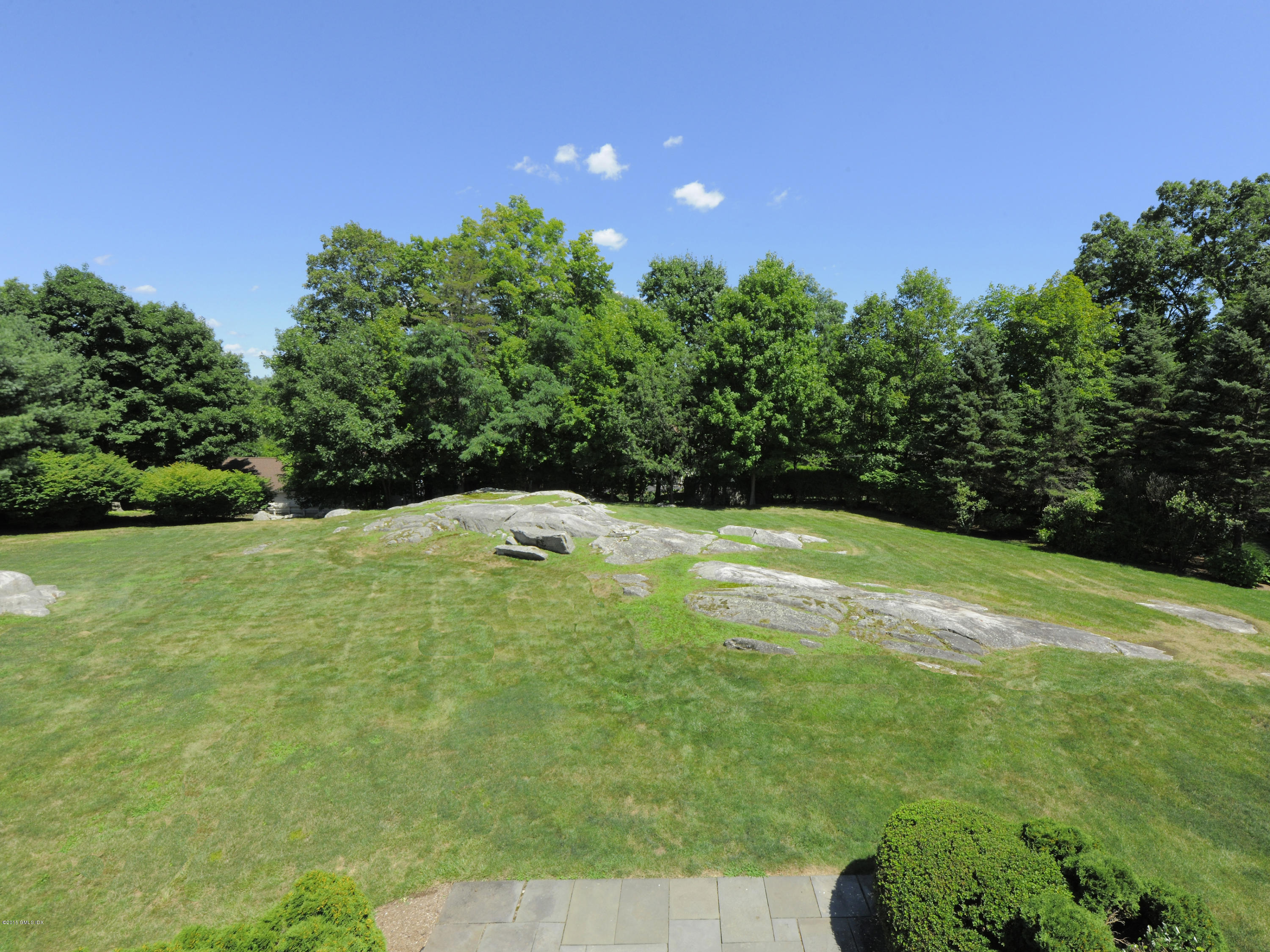 115 Doubling Road Greenwich, CT 06830 - Photo 3 of 10 a view of a green yard