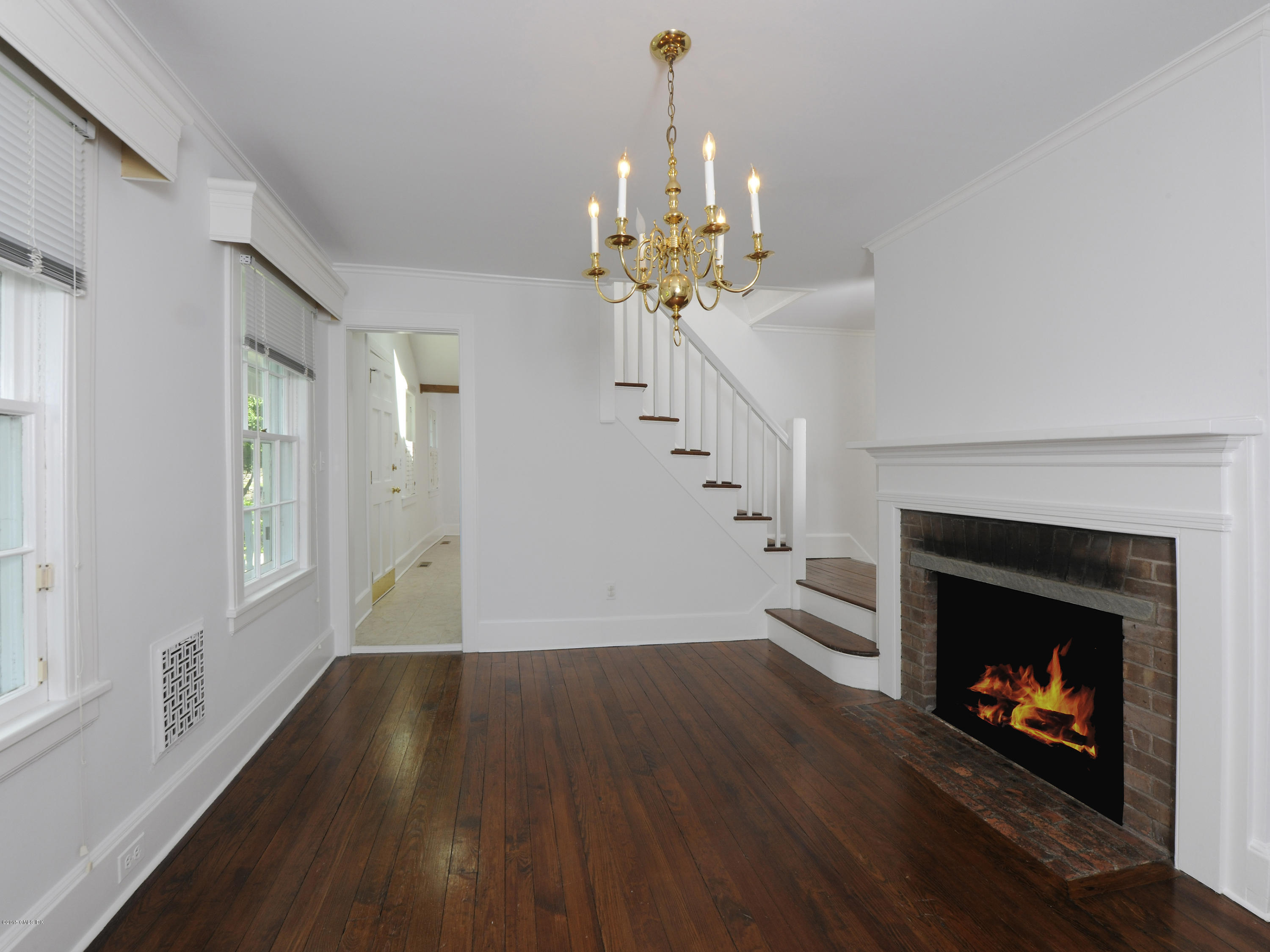115 Doubling Road Greenwich, CT 06830 - Photo 5 of 10 a living room with furniture and a fireplace