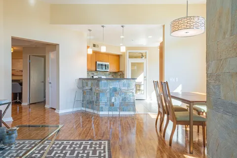a large kitchen with a table and chairs