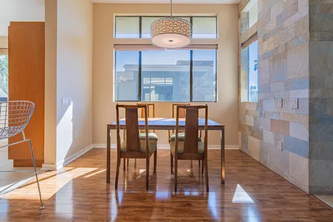 a view of a dining room with furniture window and wooden floor