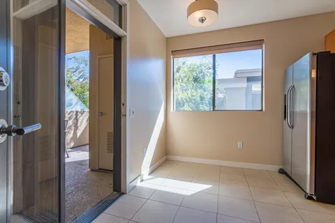 a view of a hallway with furniture and a livingroom view