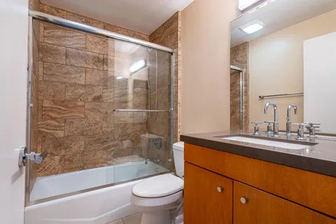 a view of a house with swimming pool and sitting area