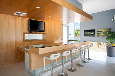 a room with gym equipment and a large window