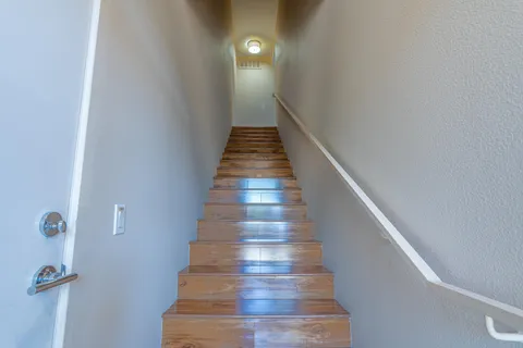 a dinning room with mini door and wooden floor