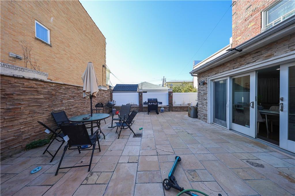 468 Ave Y Brooklyn, NY 11223 - Photo 11 of 47 a view of a dinning tables and chairs in the patio