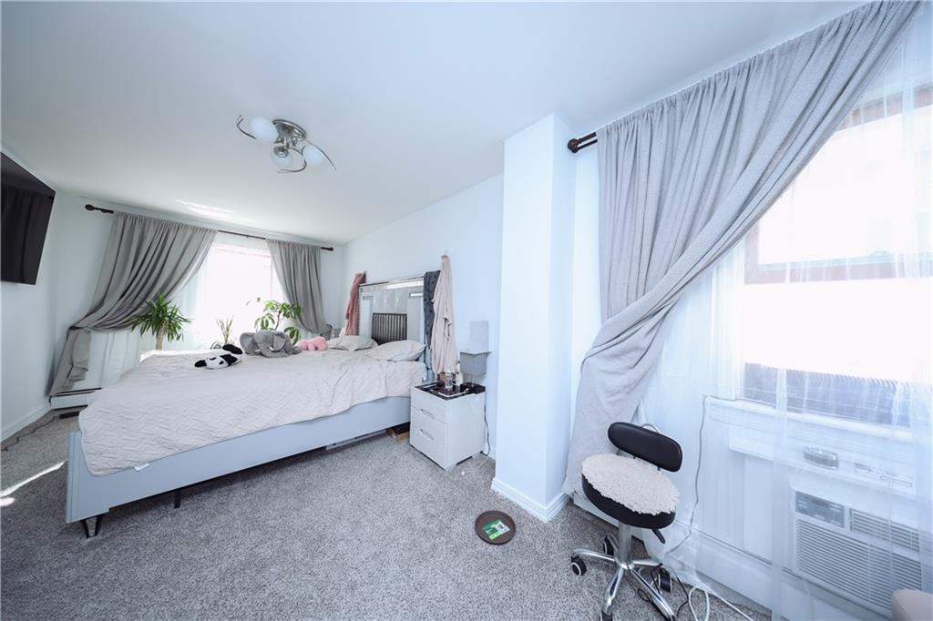 468 Ave Y Brooklyn, NY 11223 - Photo 14 of 47 a living room with furniture and a window