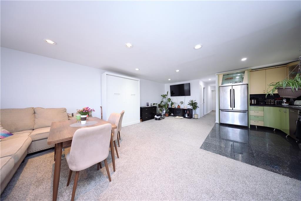 468 Ave Y Brooklyn, NY 11223 - Photo 18 of 47 a living room with furniture and a wooden floor