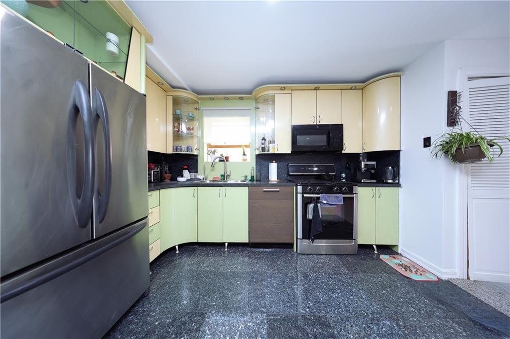 468 Ave Y Brooklyn, NY 11223 - Photo 20 of 47 a kitchen with stainless steel appliances a refrigerator sink and stove