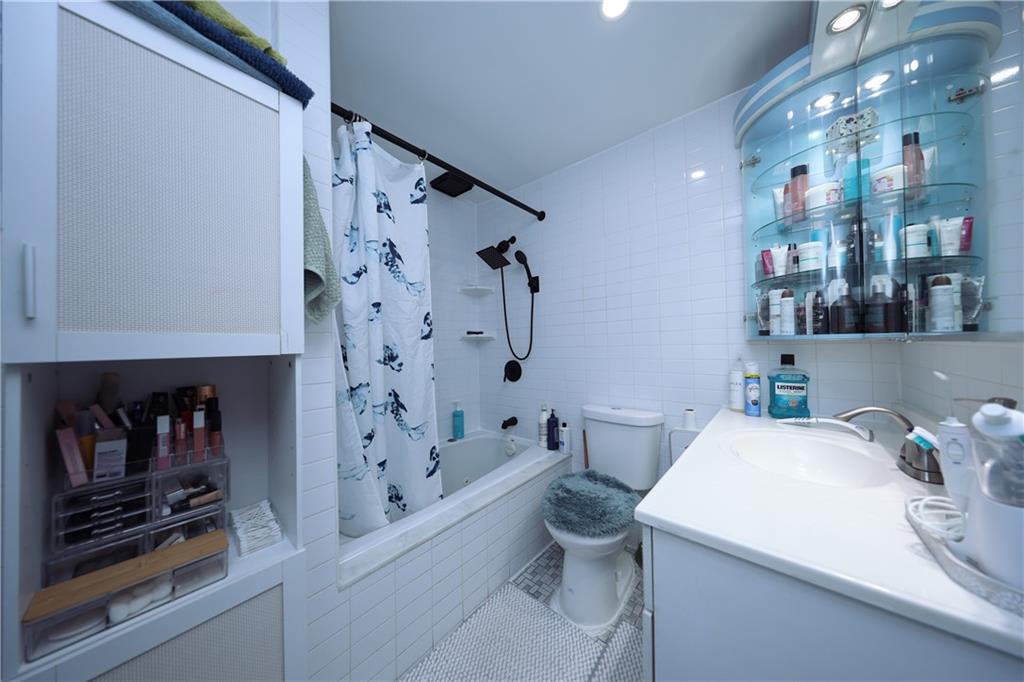 468 Ave Y Brooklyn, NY 11223 - Photo 33 of 47 a bathroom with a sink a toilet and shower