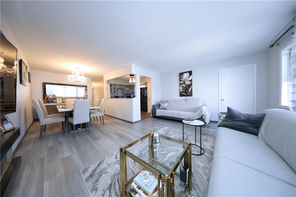 468 Ave Y Brooklyn, NY 11223 - Photo 37 of 47 a living room with furniture and a wooden floor