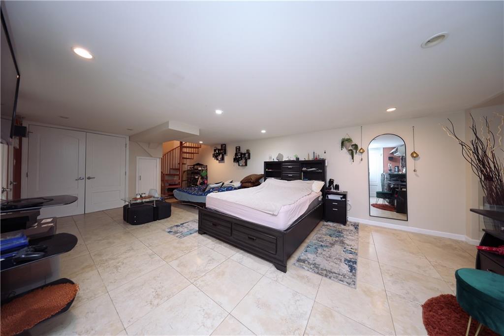 468 Ave Y Brooklyn, NY 11223 - Photo 39 of 47 a bedroom with furniture and a gym equipment