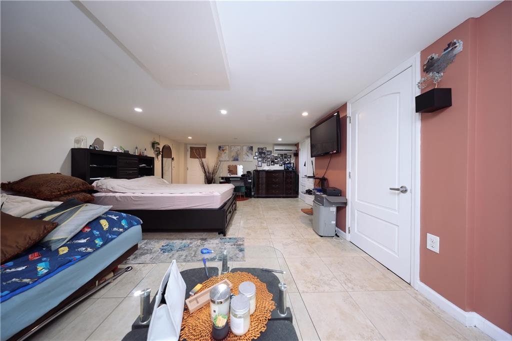 468 Ave Y Brooklyn, NY 11223 - Photo 42 of 47 a kitchen with stainless steel appliances kitchen island granite countertop a stove a sink and a refrigerator