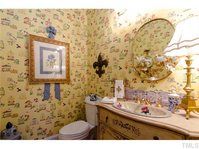105 Carpathian Way Raleigh, NC 27615 - Photo 14 of 25 a bathroom with a sink toilet and mirror