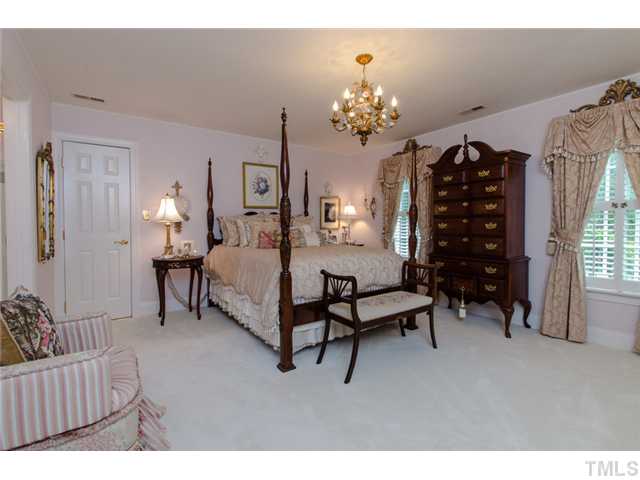 105 Carpathian Way Raleigh, NC 27615 - Photo 15 of 25 a living room with furniture and a chandelier
