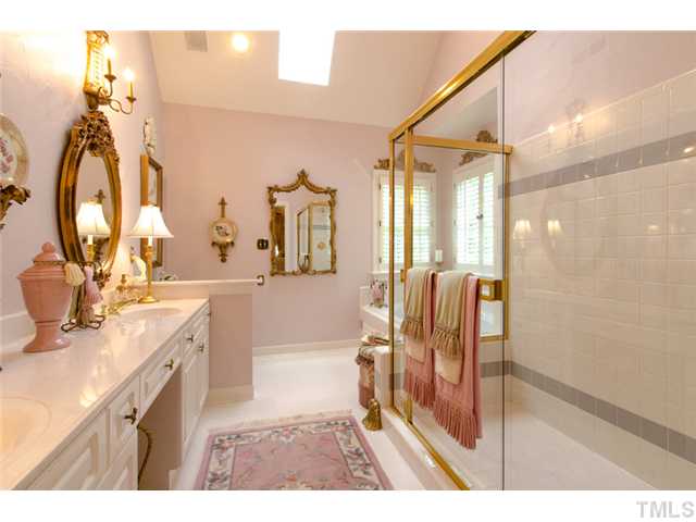 105 Carpathian Way Raleigh, NC 27615 - Photo 16 of 25 a bathroom with a sink double vanity and a mirror