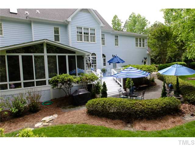 105 Carpathian Way Raleigh, NC 27615 - Photo 24 of 25 a front view of a house with garden and porch