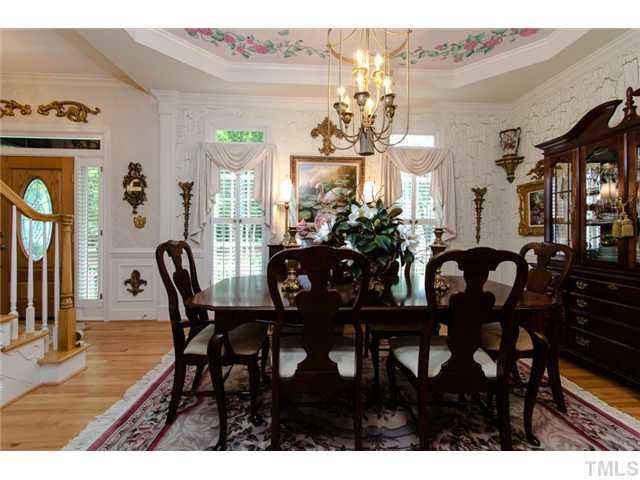 105 Carpathian Way Raleigh, NC 27615 - Photo 5 of 25 a view of a dining room with furniture and chandelier