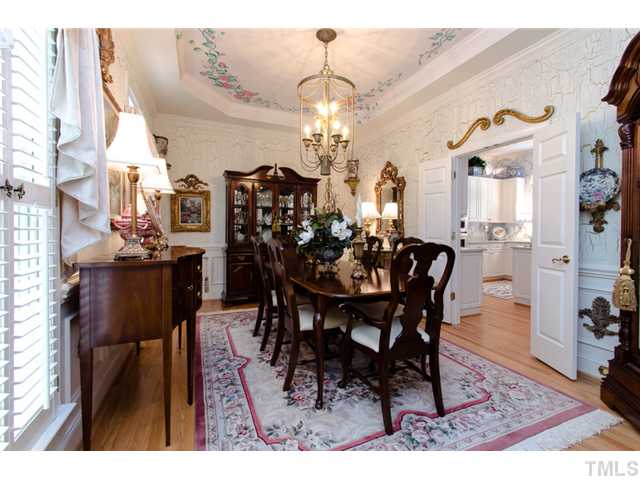 105 Carpathian Way Raleigh, NC 27615 - Photo 6 of 25 a view of a dining room with furniture and chandelier