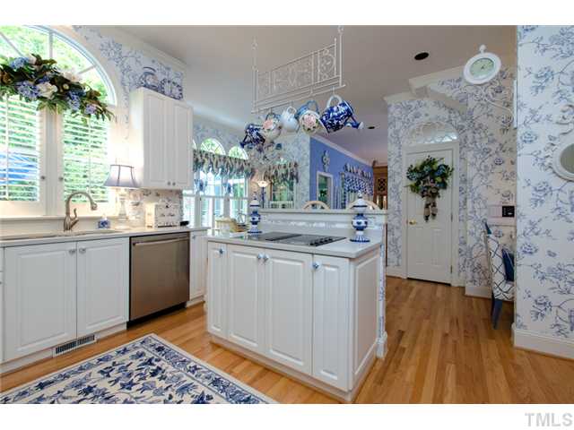105 Carpathian Way Raleigh, NC 27615 - Photo 9 of 25 a kitchen with cabinets a sink and appliances