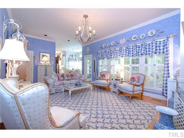 105 Carpathian Way Raleigh, NC 27615 - Photo 10 of 25 a living room with furniture a chandelier and a rug