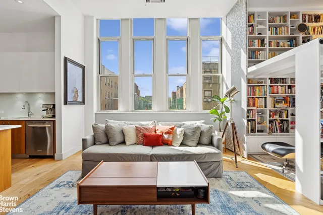 a living room with furniture and a rug