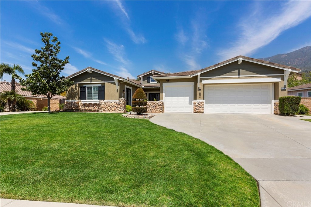 5094 Carriage Road Rancho Cucamonga, CA 91737 - Photo 1 of 1 a front view of a house with garden