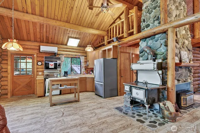 a view of living room with furniture and wooden floor