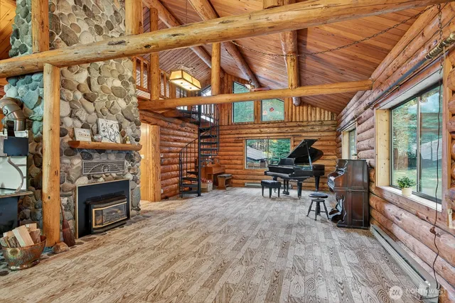 a view of a porch with furniture and a yard