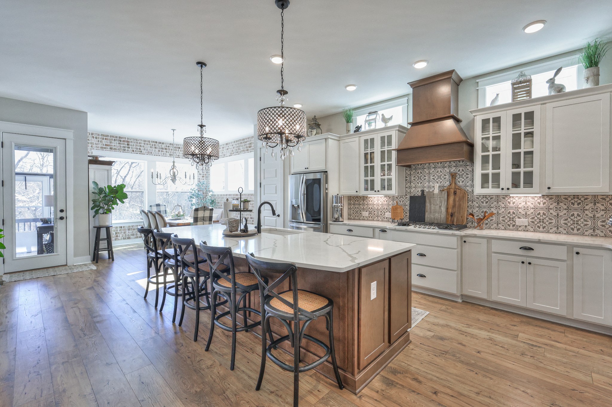7760 Thayer Road Nolensville, TN 37135 - Photo 14 of 58 a large kitchen with cabinets chairs and wooden floor