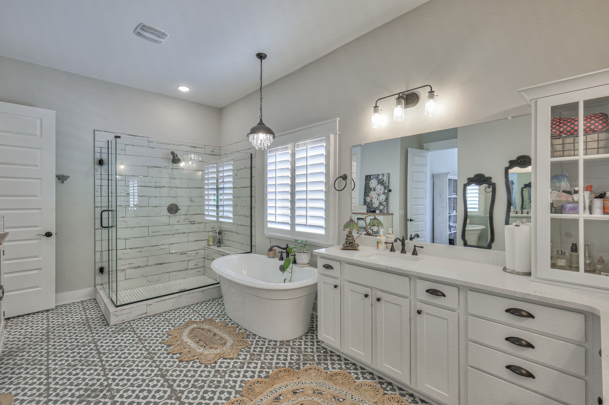 7760 Thayer Road Nolensville, TN 37135 - Photo 29 of 58 a spacious bathroom with a double vanity sink a mirror and a bathtub