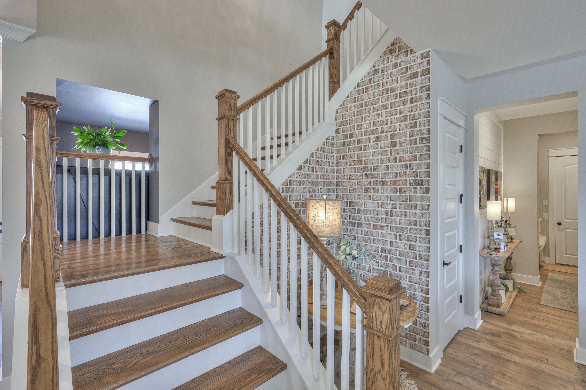 7760 Thayer Road Nolensville, TN 37135 - Photo 41 of 58 a view of staircase with wooden floor and a front door