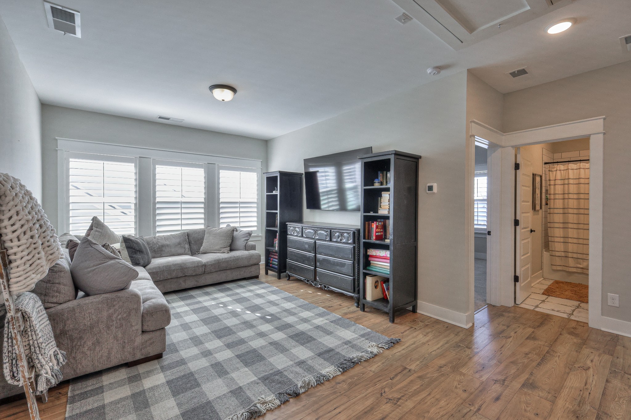 7760 Thayer Road Nolensville, TN 37135 - Photo 47 of 58 a living room with furniture and a wooden floor