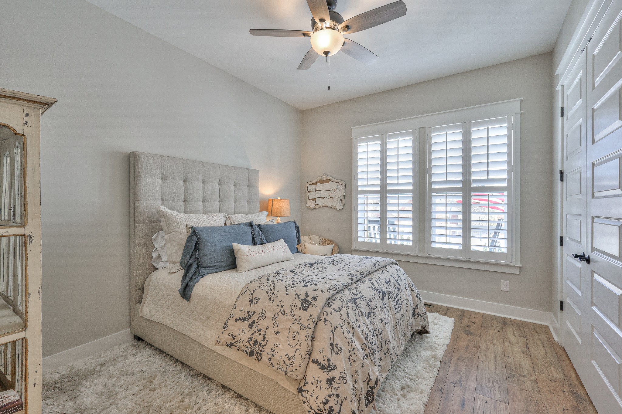 7760 Thayer Road Nolensville, TN 37135 - Photo 5 of 58 a bedroom with a large bed and a chandelier