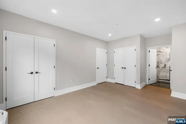a bathroom with a sink mirror and shower